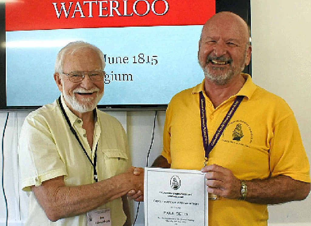 Ian Edwardson congratulates Paul Seto on his presentation of the 200th anniversary of the Battle of Waterloo. Ian Edwardson congratulates Paul Seto on his presentation of the 200th anniversary of the Battle of Waterloo.